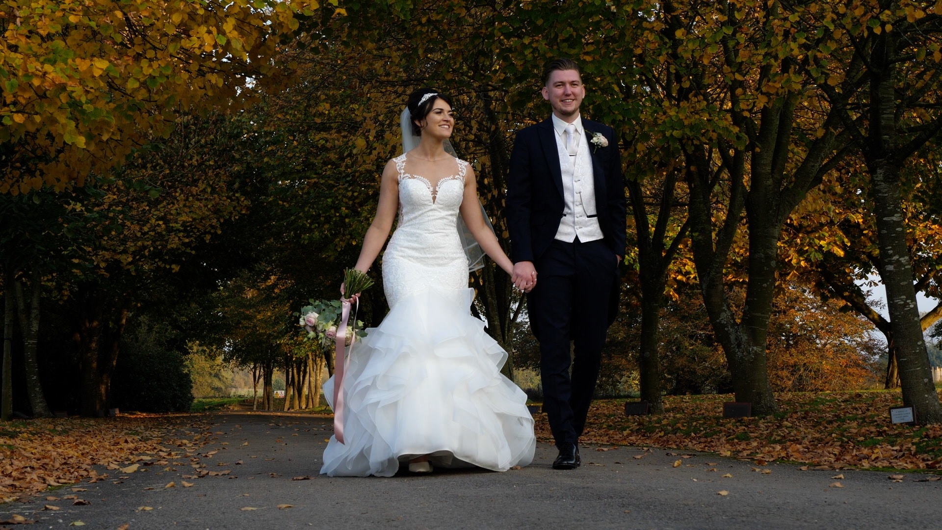Bride and groom walking holding hands - Wedding Videographer for Intimate or Small Weddings